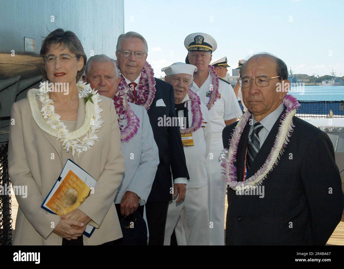 US Navy  Members of the official party, including Hawaii Gov. Linda Lingle, prepare to enter the ceremonial stage prior to the start of the 60th Anniversary of the end of World War II held aboard the USS Misso. Stock Photo
