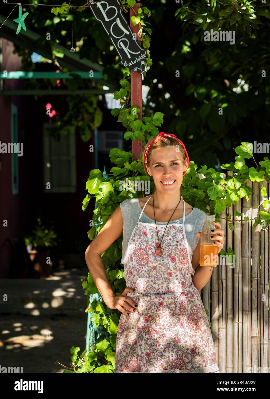 Smiling entrepreneur outisde her juice shop. Copy space Stock Photo