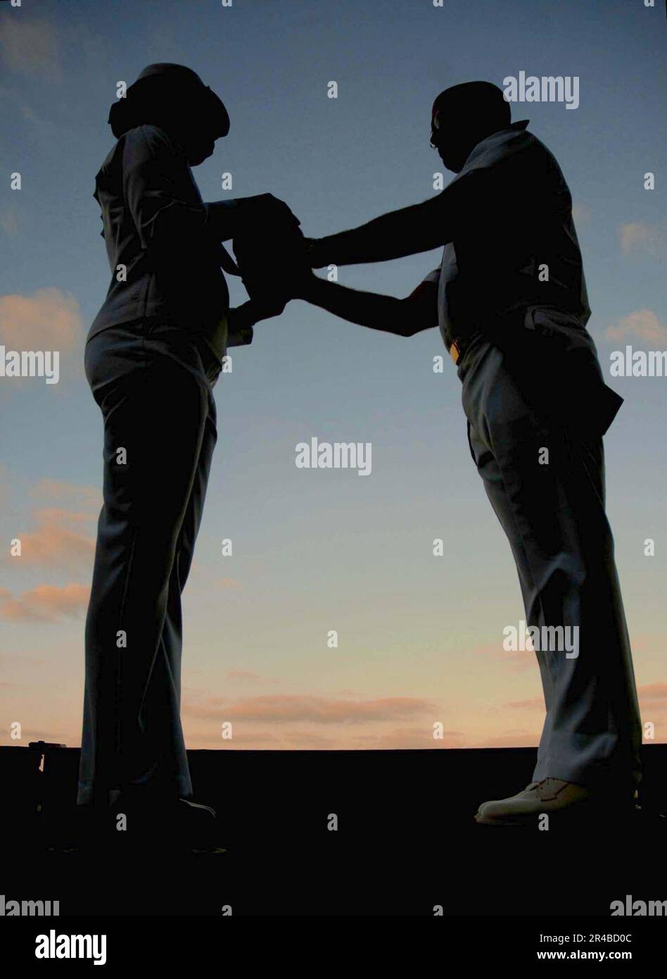 US Navy The urn bearer exchanges remains with the Catholic chaplain