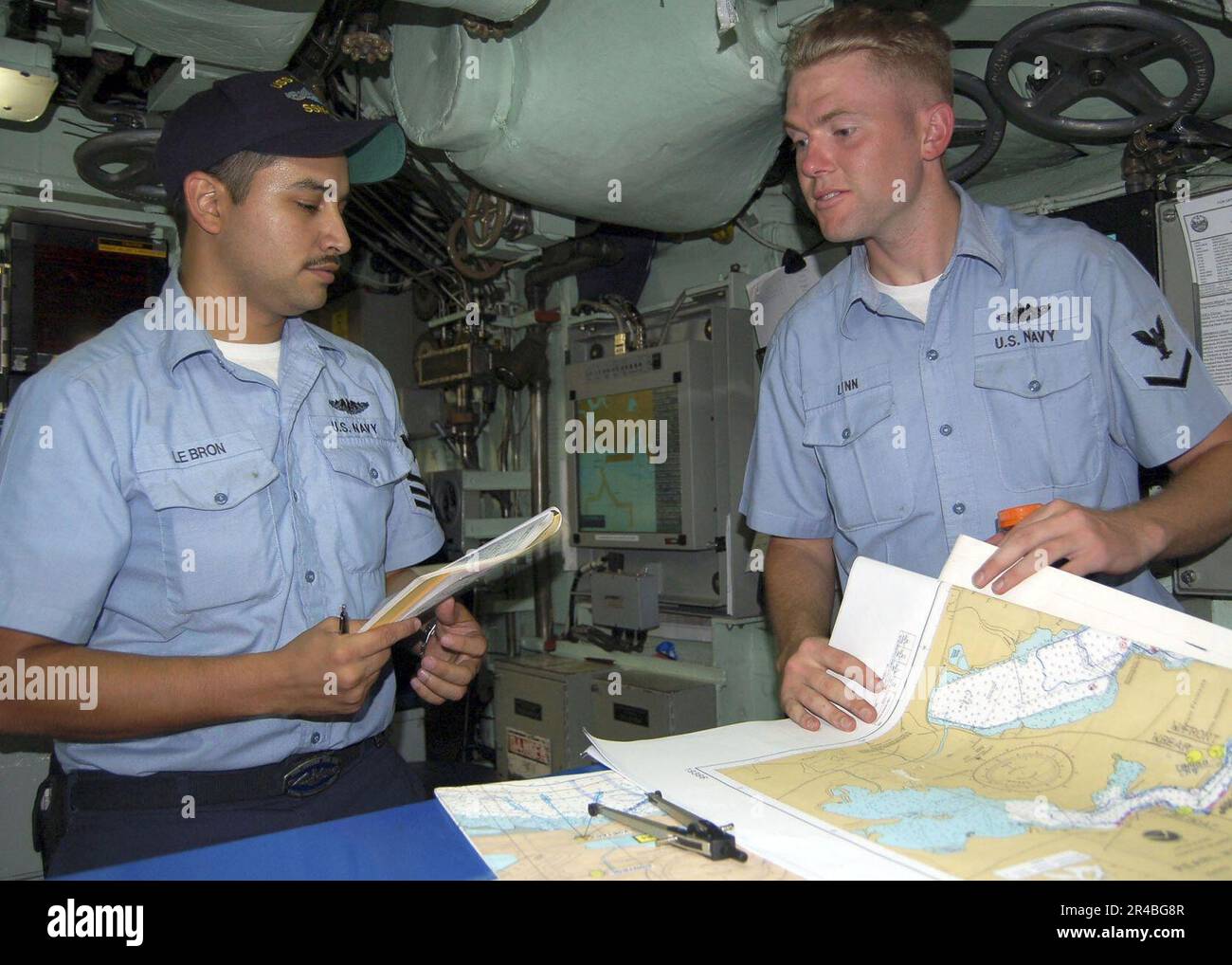 US Navy Sailors aboard the Los Angelesclass fast attack submarine USS
