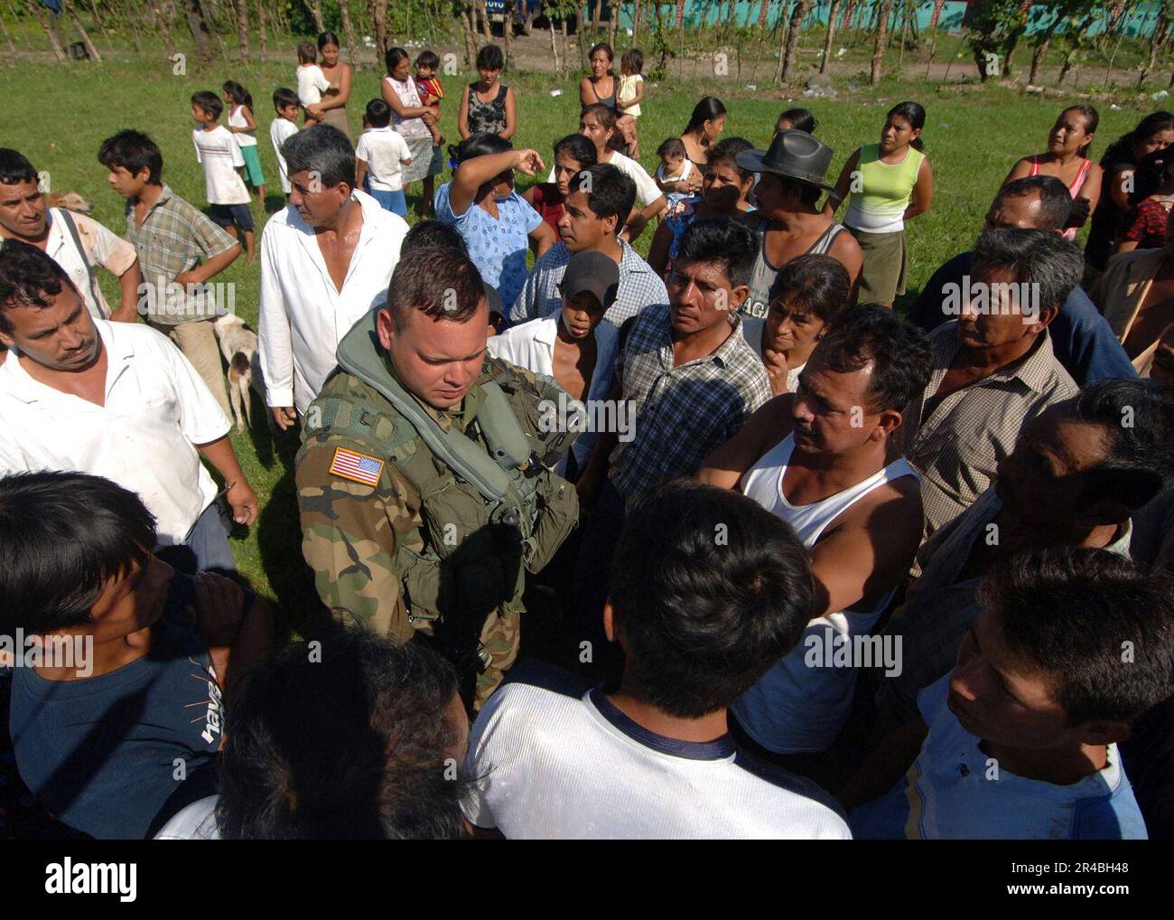 US Navy U.S. Army Sgt. assigned to the 1st 128th United States Air Ambulance Detachment, discusses medical issues with locals from a small village in Guatemala Stock Photo