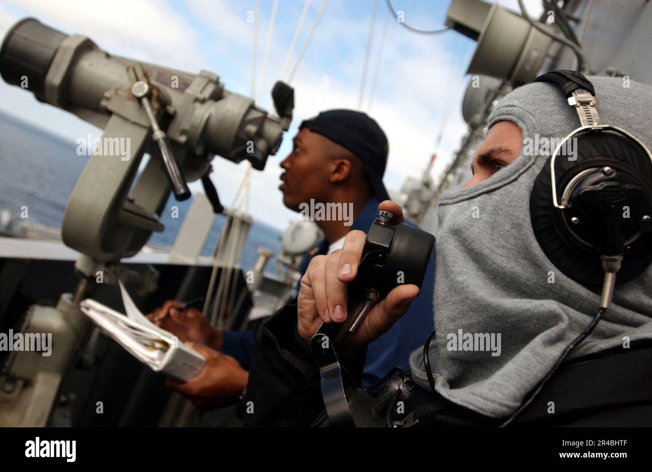 US Navy Operations Specialist Seaman communicates on a sound powered