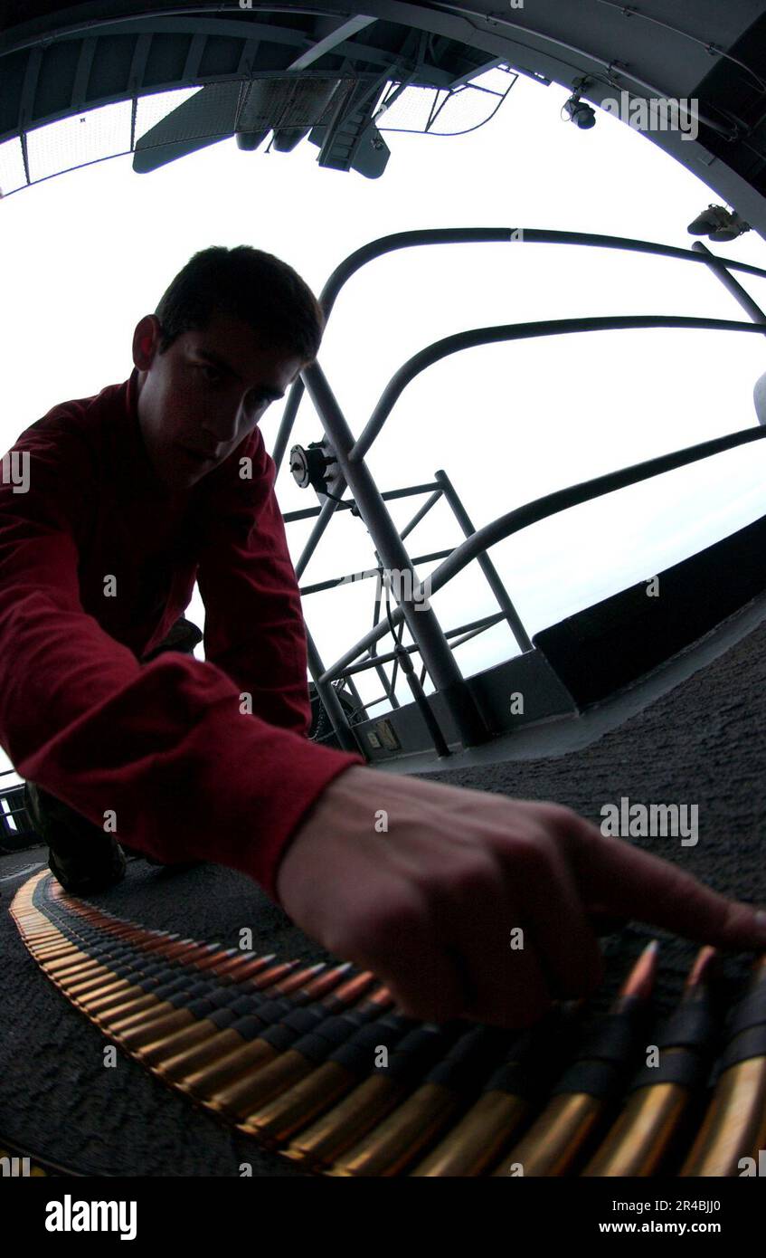 US Navy Gunner's Mate 2nd Class counts the remaining fifty-caliber