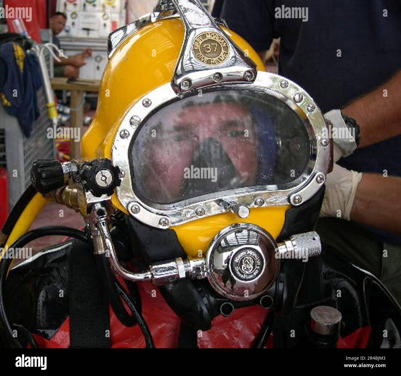 Navy diver ensures a proper seal on the Kirby Morgan 37 di…