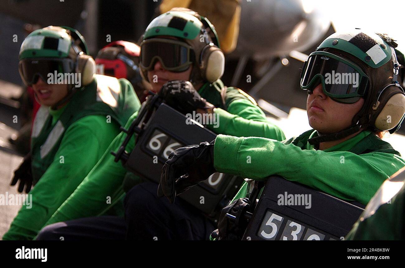 US Navy Weight board operators look on as cyclic flight operations are ...