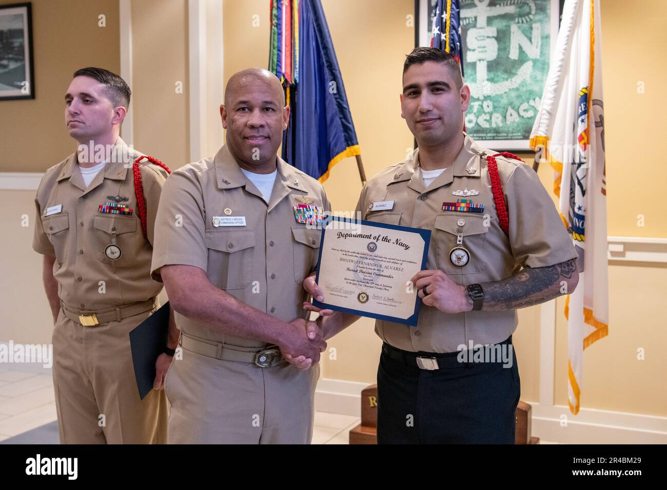 Sailors receive certificates during Recruit Division Commander 'C' School graduation. More than 40,000 recruits train annually at the Navy's only boot camp. Stock Photo