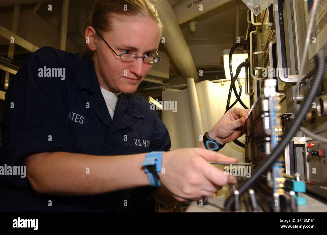 US Navy Aviation Electronics Technician Airman troubleshoots a signal