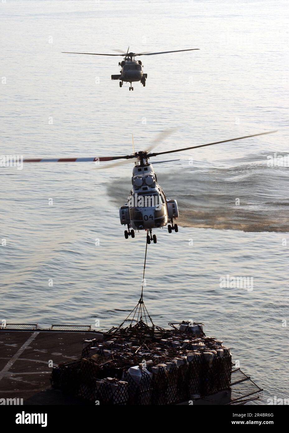 US Navy An SA 330 Puma Helicopter Lifts Cargo From The Deck Of The US Navy An SA 330 Puma Helicopter Lifts Cargo From The Deck Of The