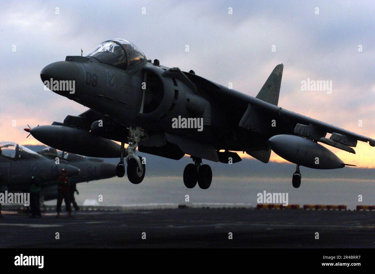 US Navy An AV-8B Harrier lands on the flight deck of the amphibious ...