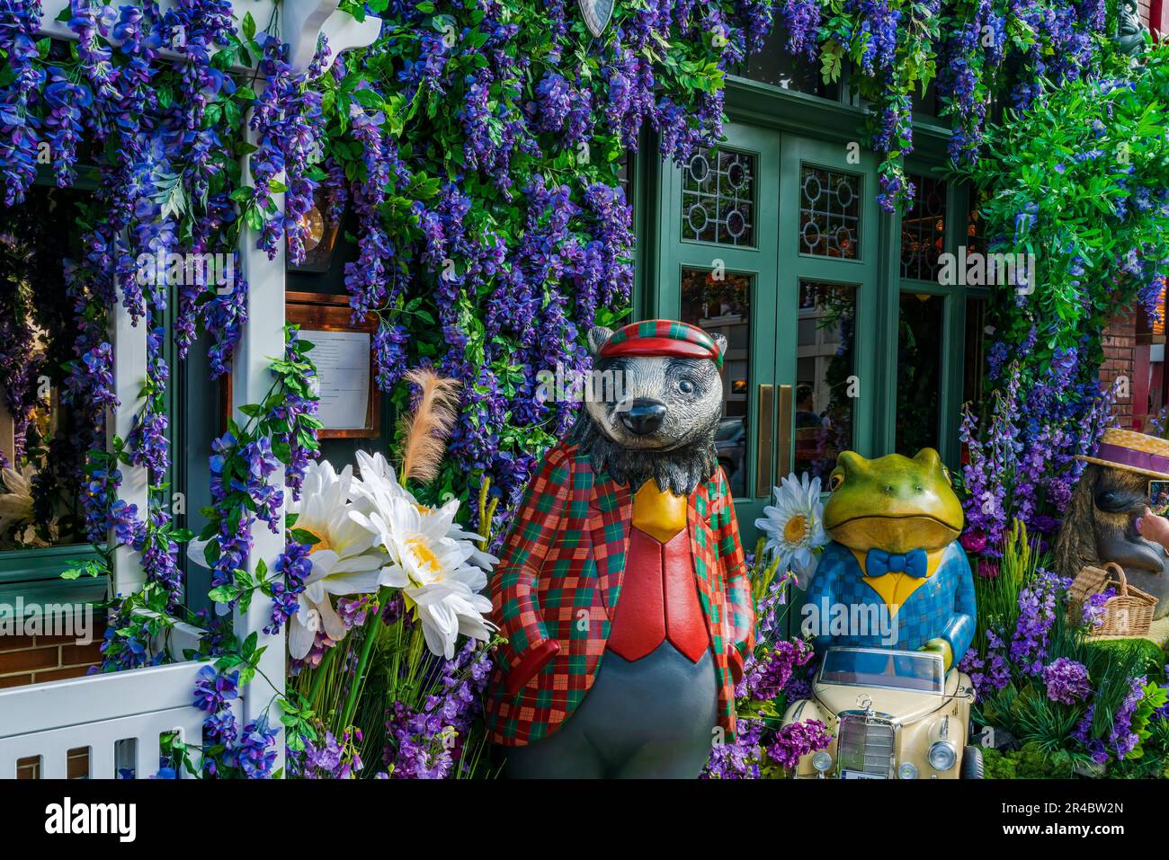LONDON, UK - MAY 24, 2023: A spectacular floral display decorates window of The Ivy restaurant in Chelsea during Chelsea in Bloom annual floral art sh Stock Photo