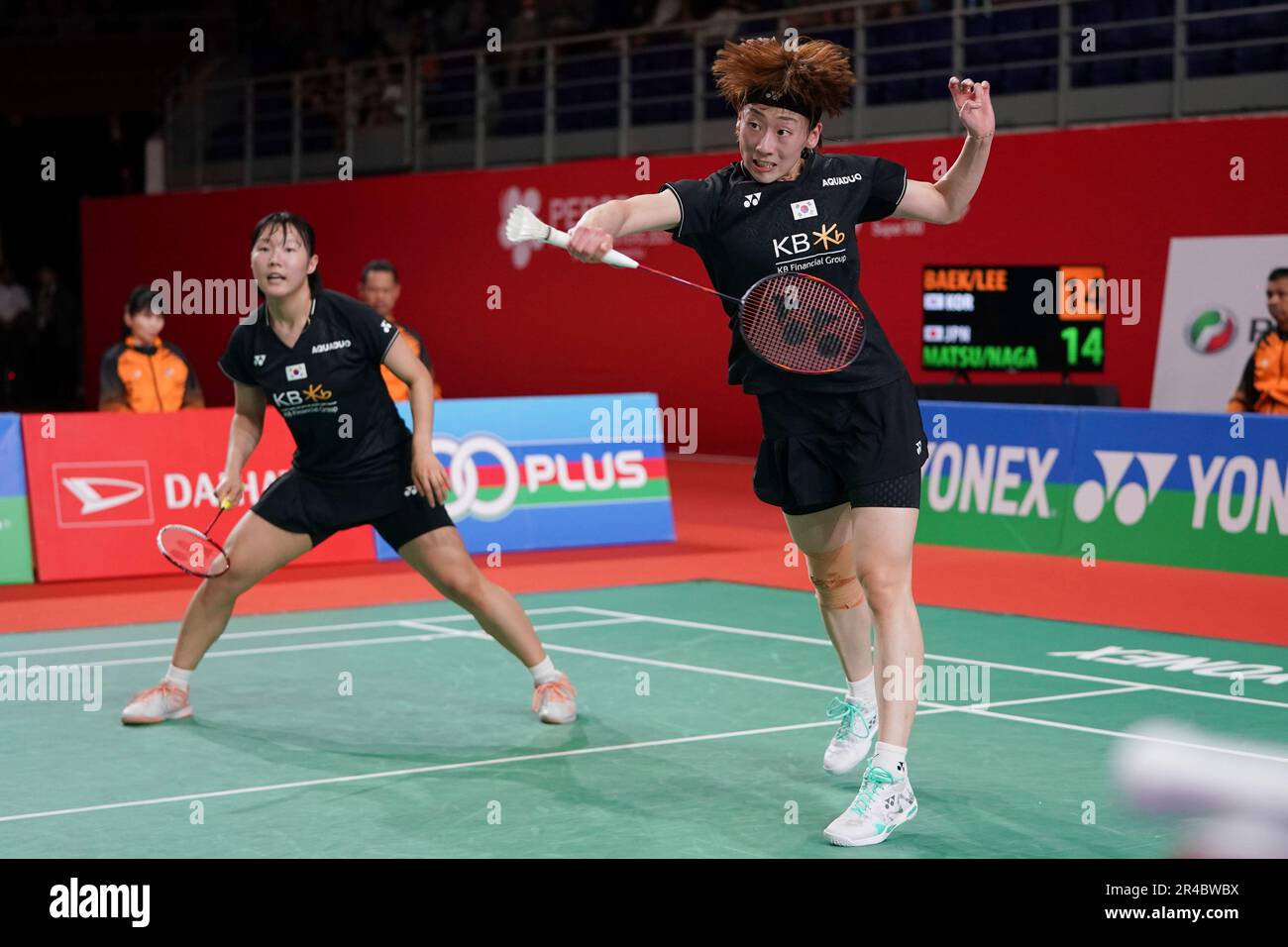 South Koreas Baek Ha Na, right, with Lee So Hee, returns a shot during their womens doubles badminton semifinals match against Japans Mayu Matsumoto and Wakana Nagahara at the Malaysia Masters badminton