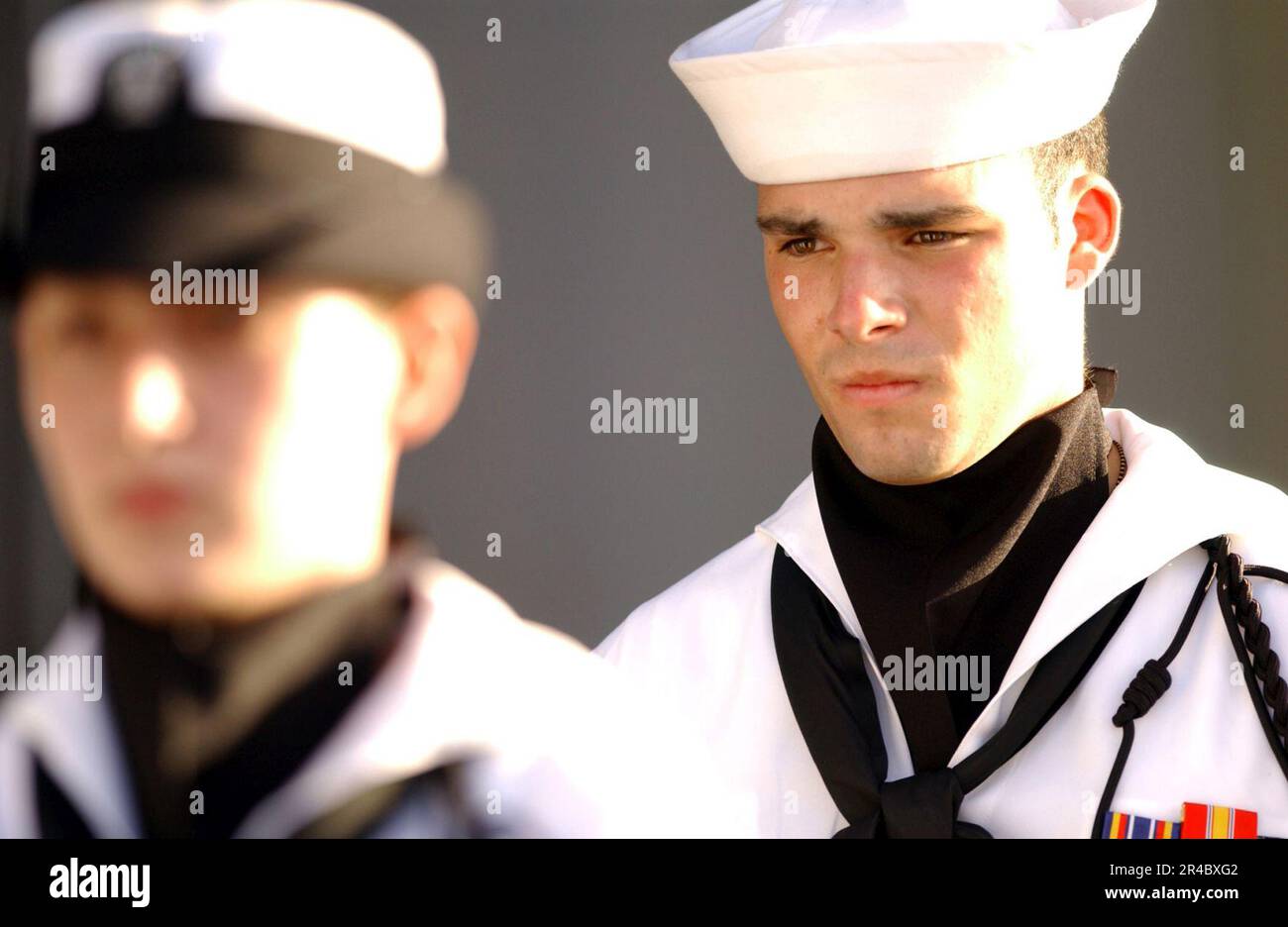Reagan Rigle US Navy A member of the honor guard's rifle team stands on position ...