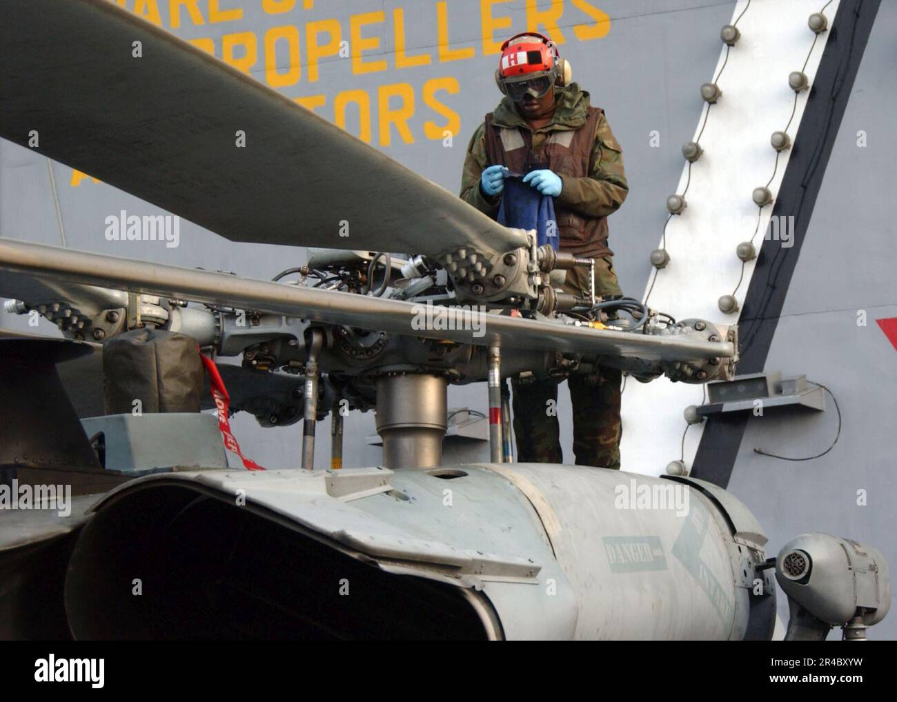 US Navy Aviation Structural Mechanic Airman performs a daily inspection