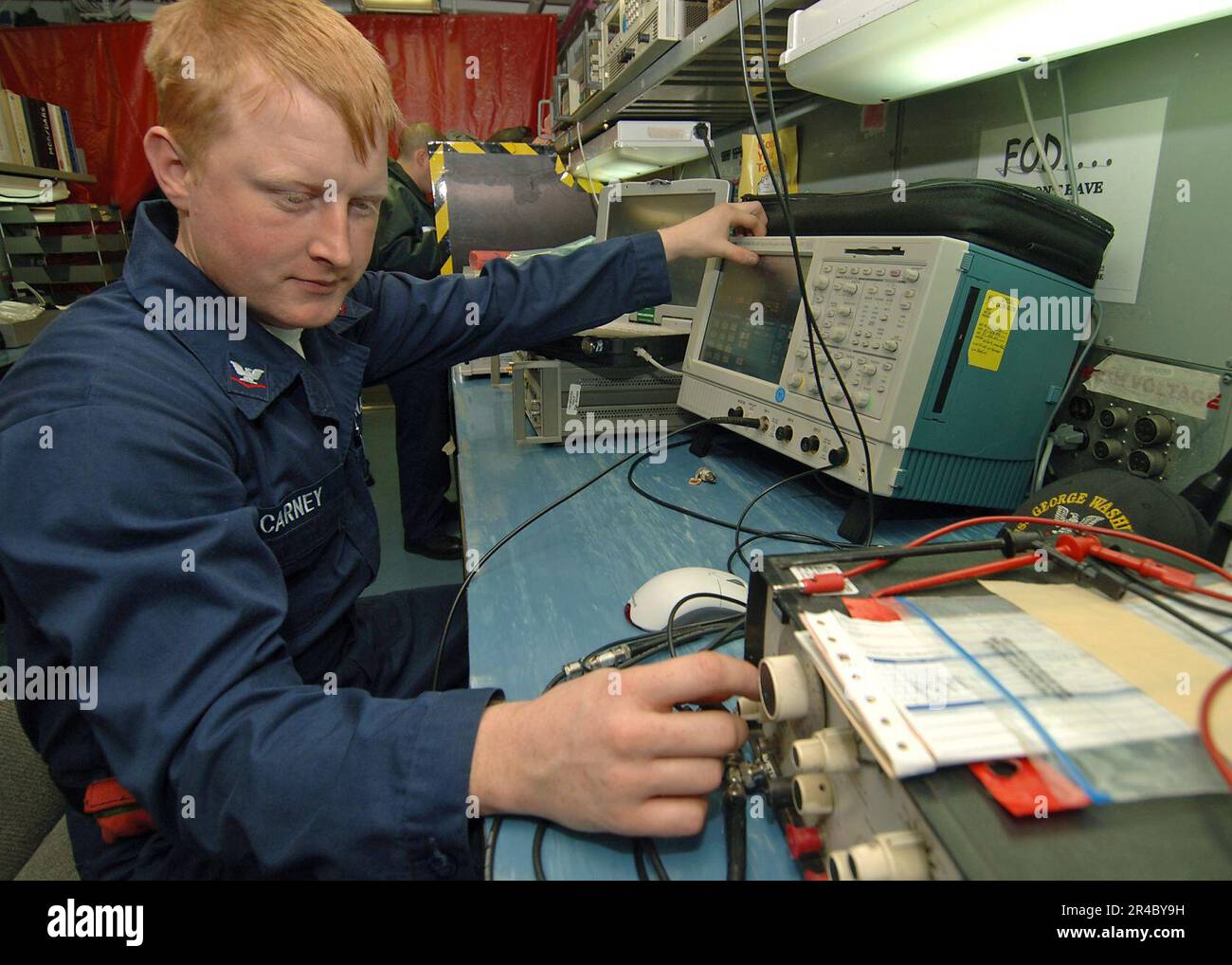 US Navy Aviation Electronics Technician 3rd Class calibrates a Wave