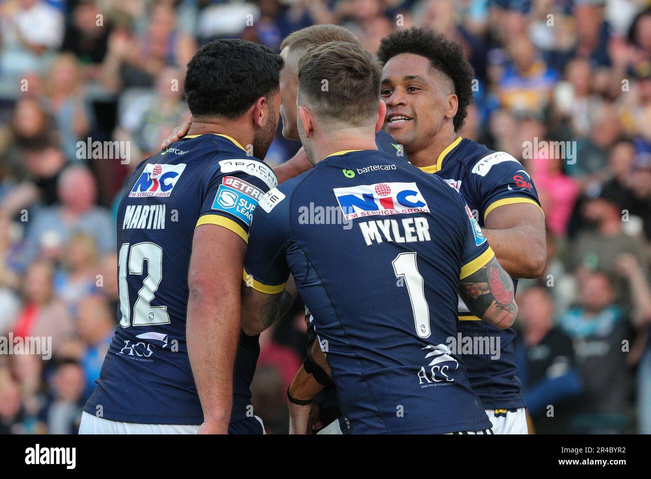 Derrell Olpherts #16 of Leeds Rhinos celebrates with his team mates ...