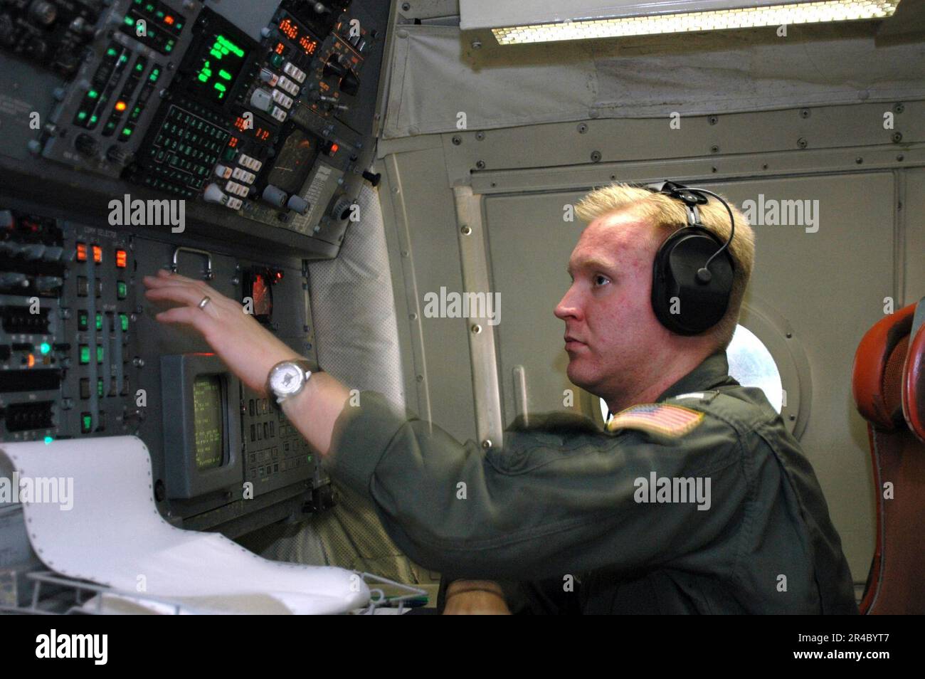 US Navy  Lt. j.g. assigned to the Tridents of Patrol Squadron Two Six (VP-26), makes pre-flight checks on his navigation and communication systems. Stock Photo