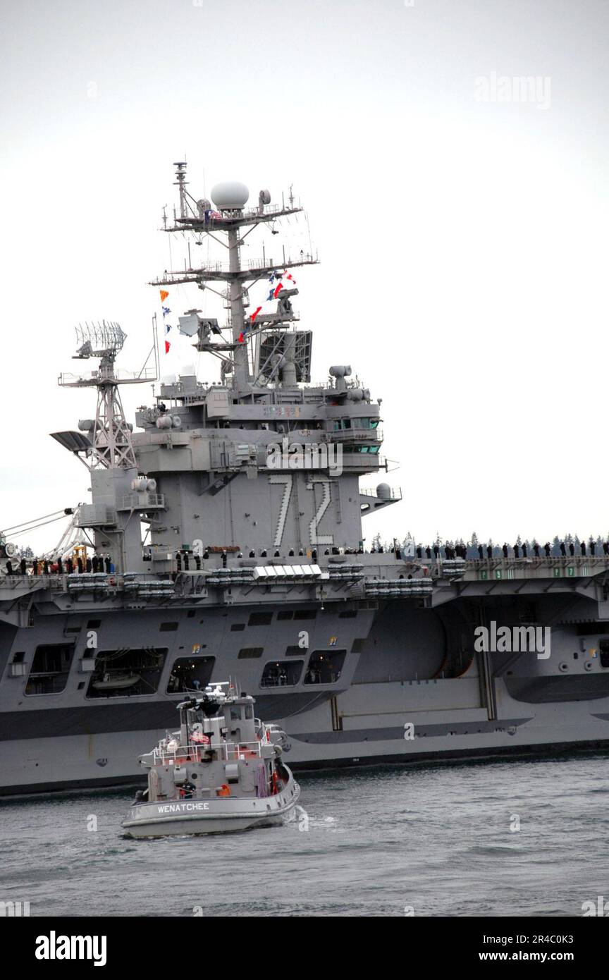 US Navy Tugboats assist the Nimitzclass aircraft carrier USS Abraham