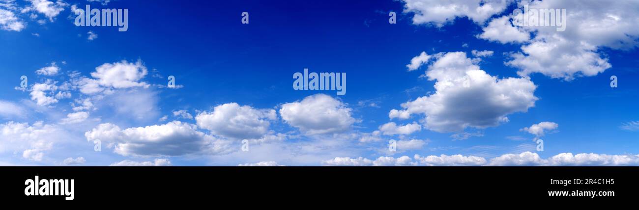 Blue sky background with white clouds. Panoramic image Stock Photo