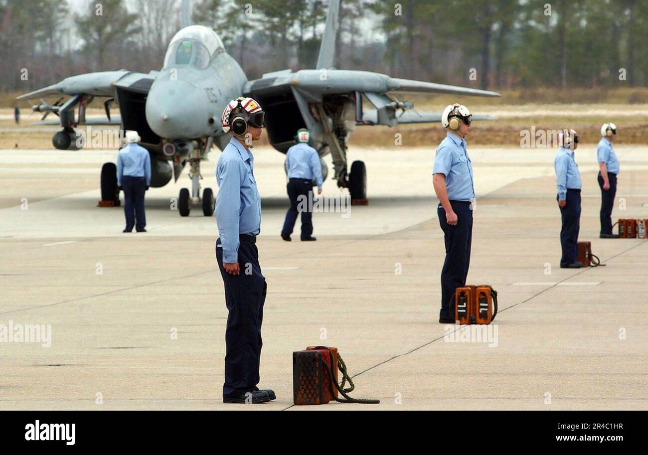US Navy Plane Captains stand ready to direct the F14 Tomcats