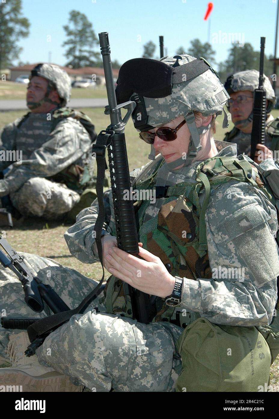US Navy  Officer-In- Charge of Operational Health Support Unit Bremerton, Lt. a Navy Reservist field strips and cleans her M16A1 Rifle during an Individual Augmentee Training Course at the McCrad. Stock Photo