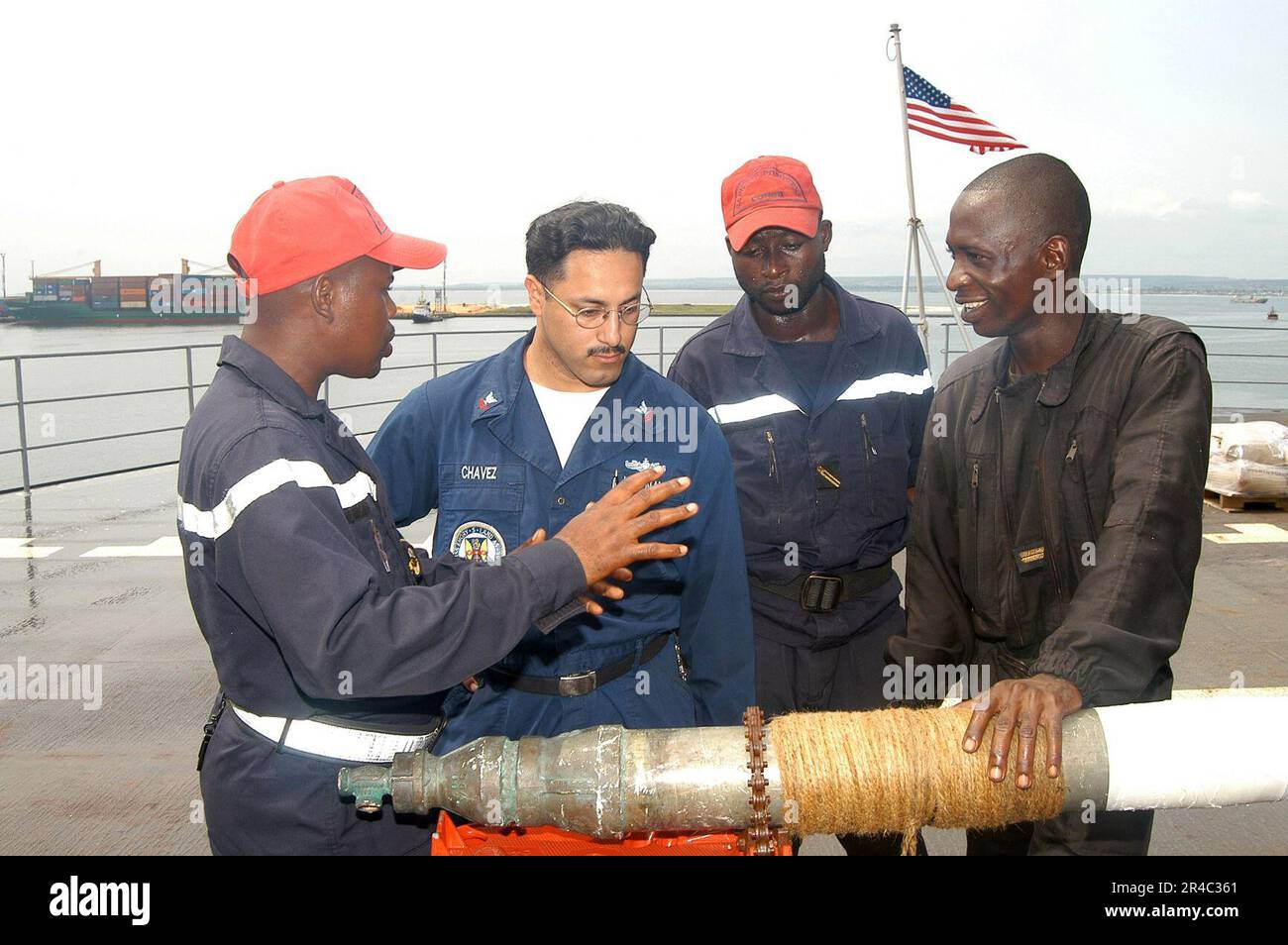 US Navy Engineman 2nd Class Anthony Bartelli (right) holds an