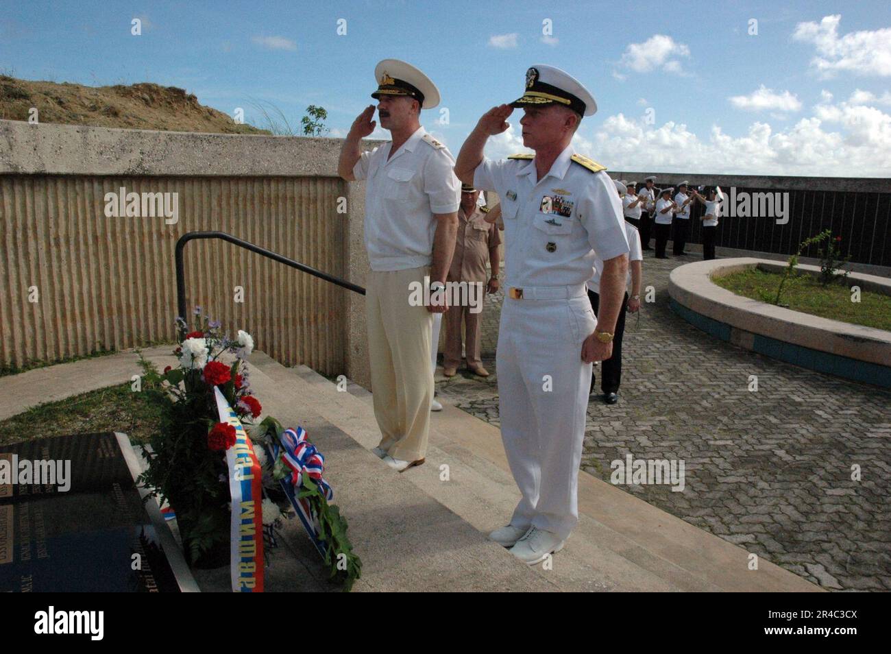 US Navy  Chief of Staff and first Deputy Commander of Russian Federated Navy Pacific Fleet Vice Adm. Konstantin Sidenko, and Commander of U.S. Naval Forces Marianas (NNS) Rear Adm. Joe Leidig salute during a w. Stock Photo