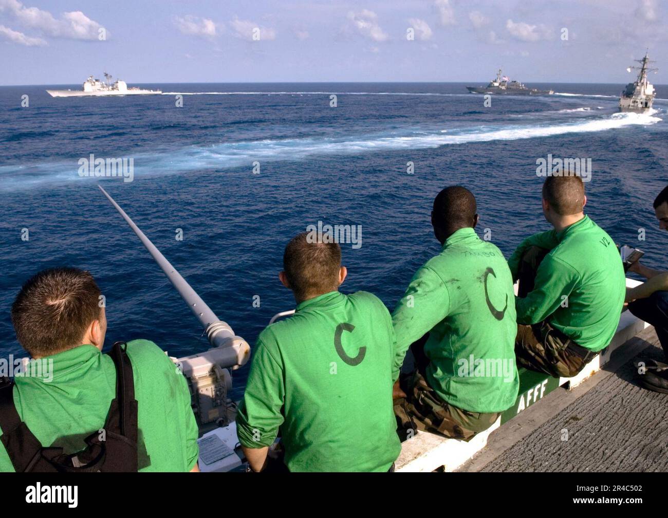 US Navy Sailors watch as USS Shoup (DDG 86), USS Mobile Bay (CG 53 ...
