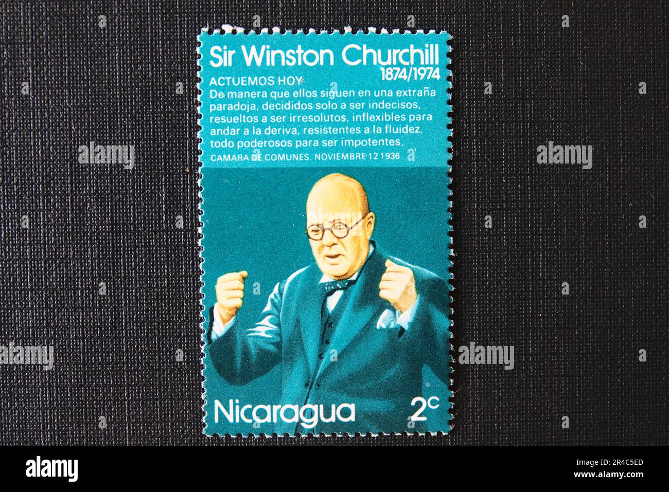 a stamp that says sir Winston Churchill has a picture of him in a suit Stock Photo