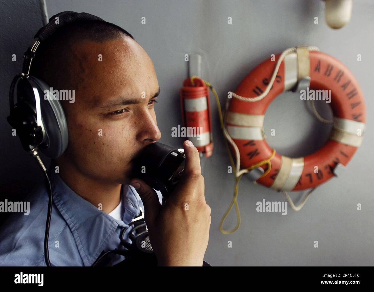 US Navy Seaman stands the starboard aft lookout during a sea and anchor ...