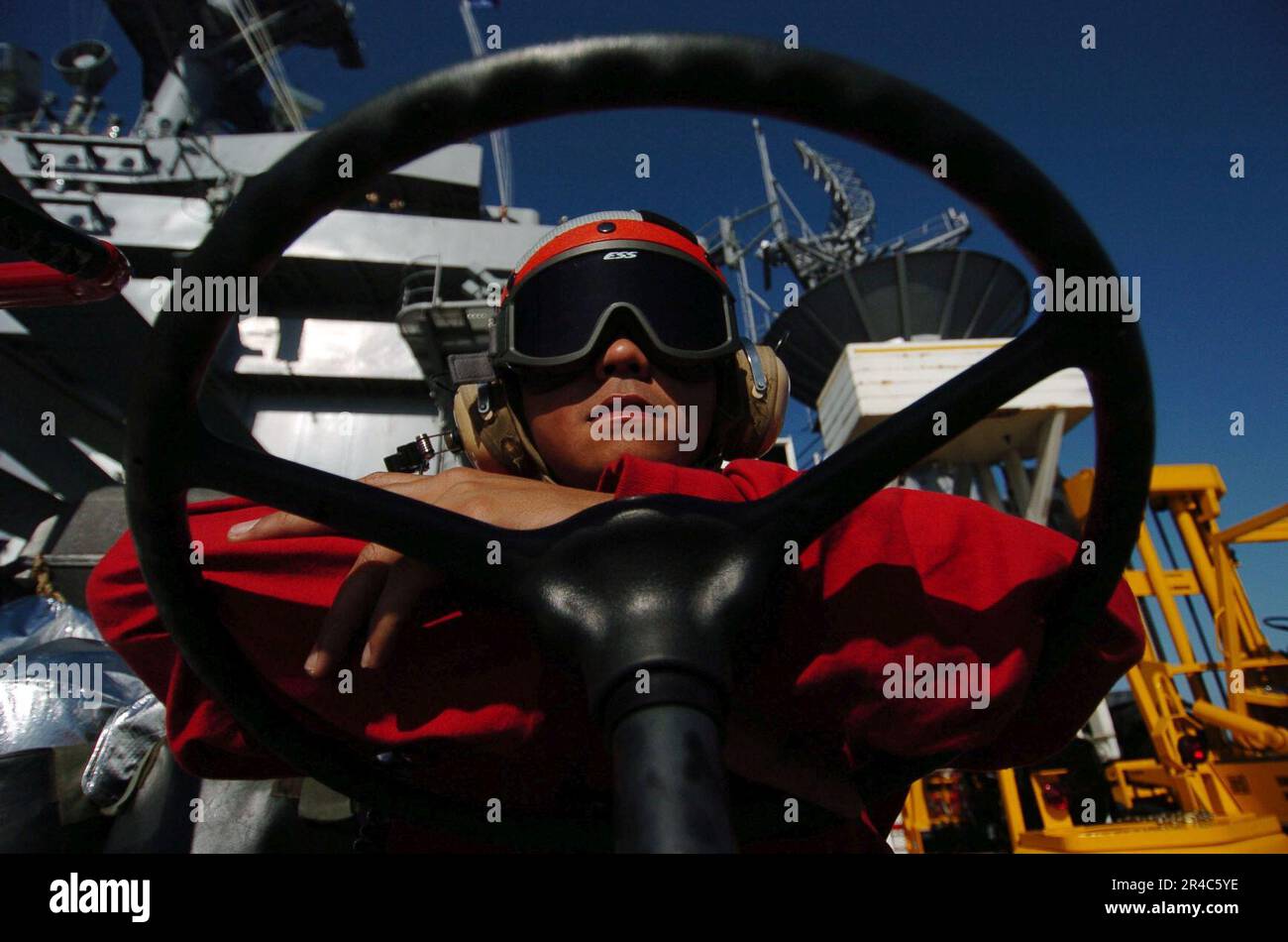 US Navy Aviation Boatswain's Mate Handler 3rd Class stands by for fire