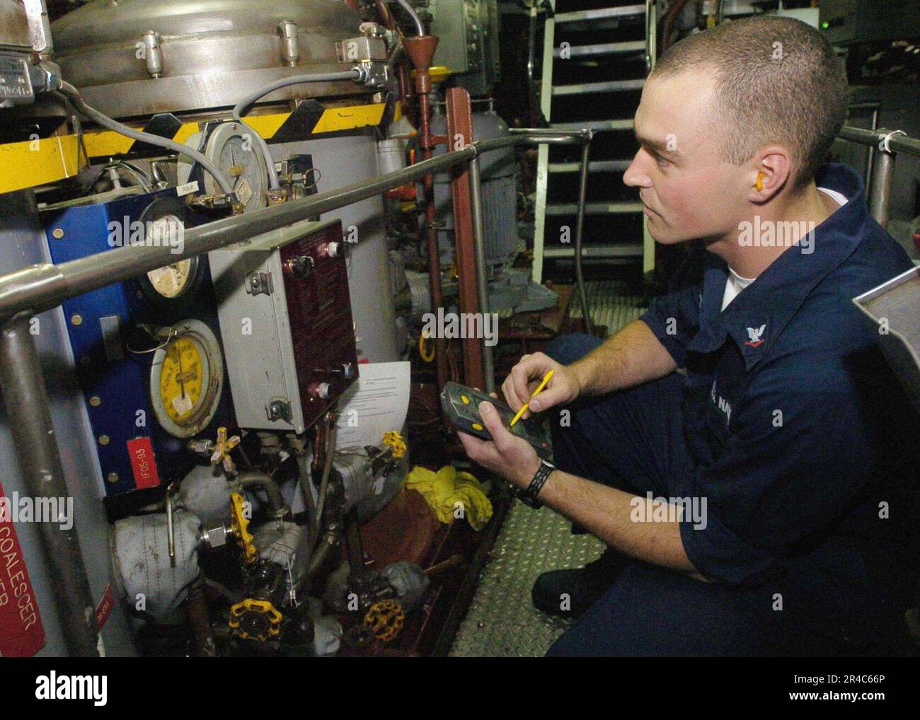US Navy Gas Turbine Systems Technician 3rd Class records the reading of