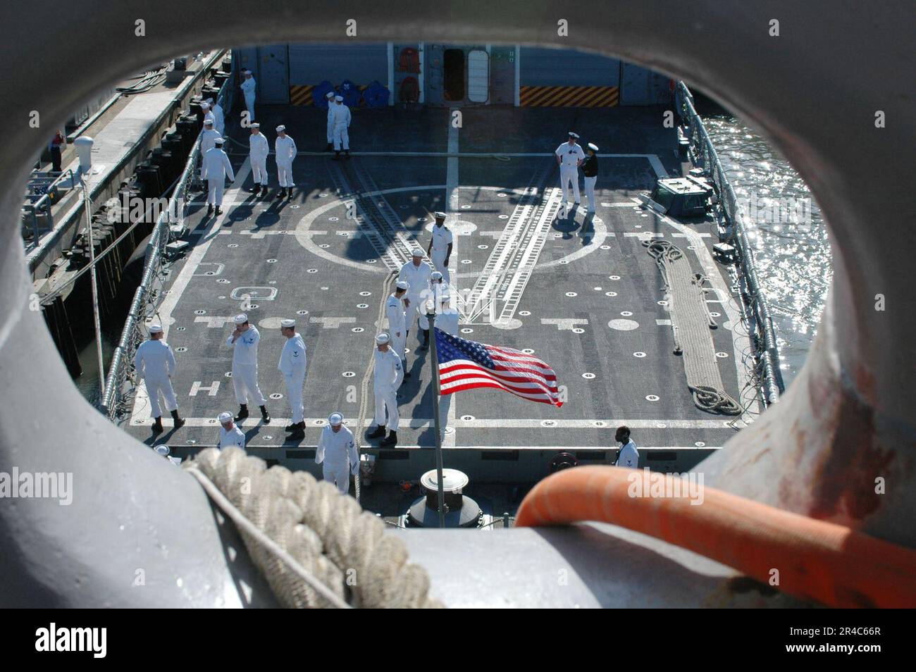US Navy Sailors man the rails aboard the guided missile frigate USS