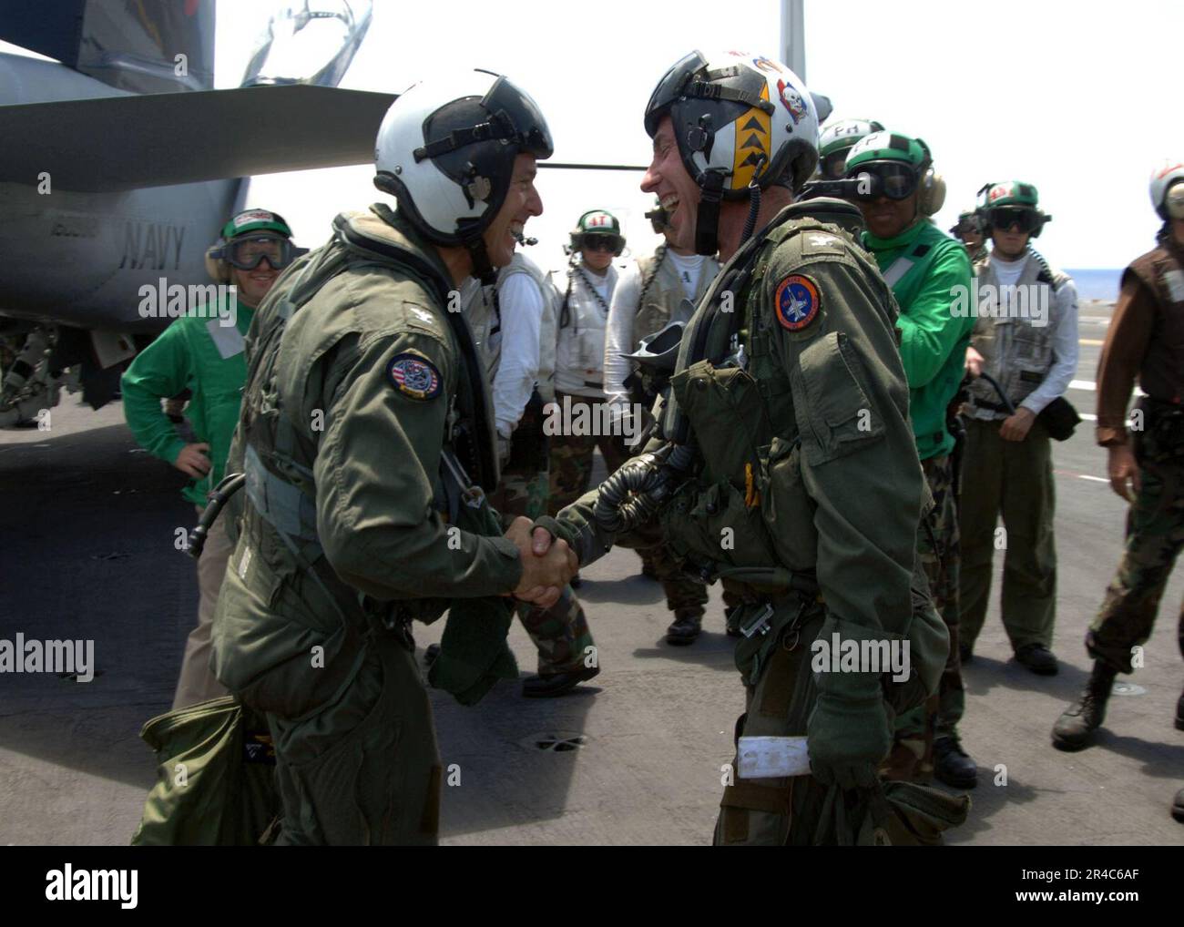 US Navy Capt. shakes hands with Capt. during a change of command ...