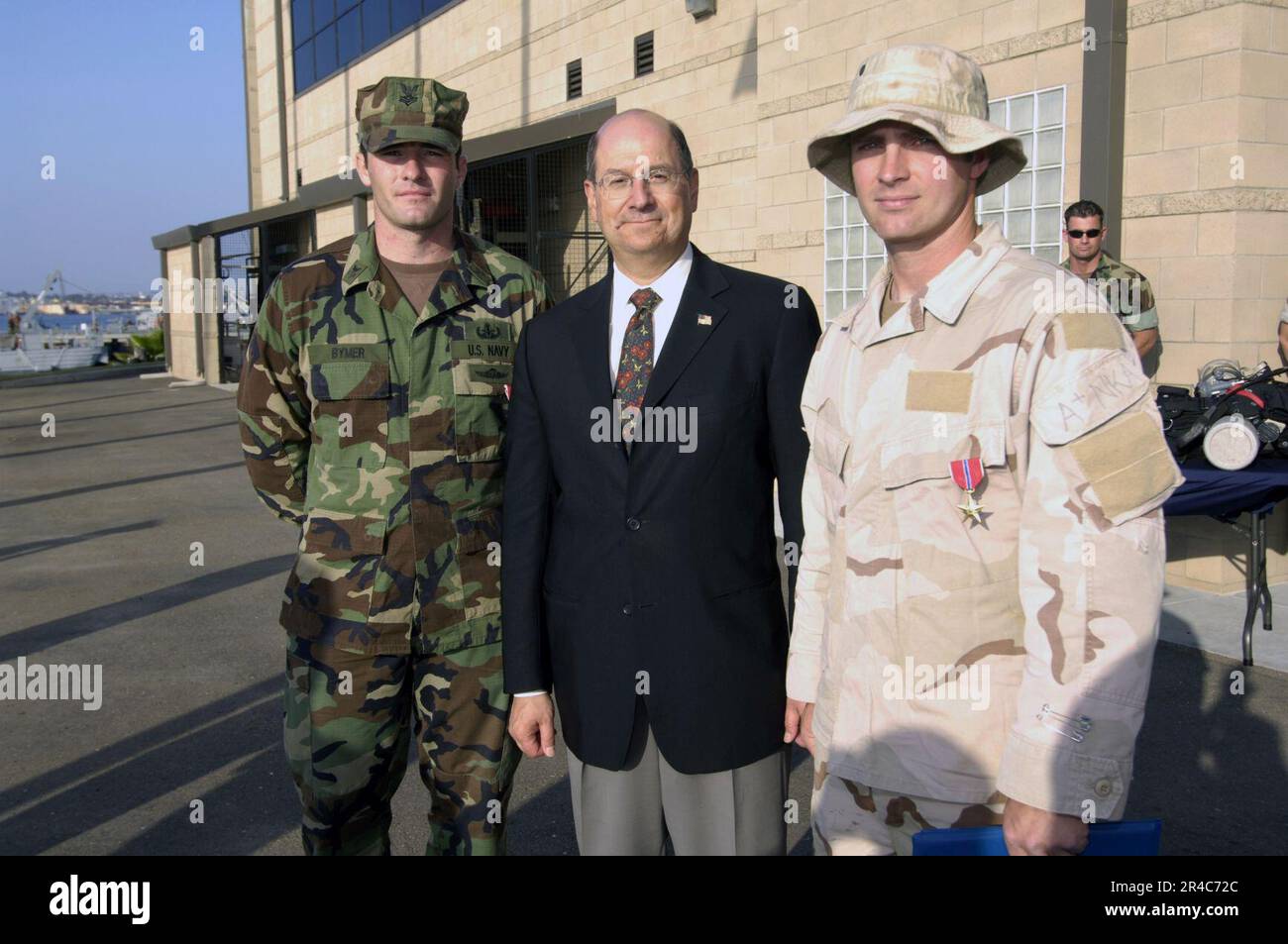 US Navy SECNAV presents the Bronze Star medal to AO1 and ET1 for their