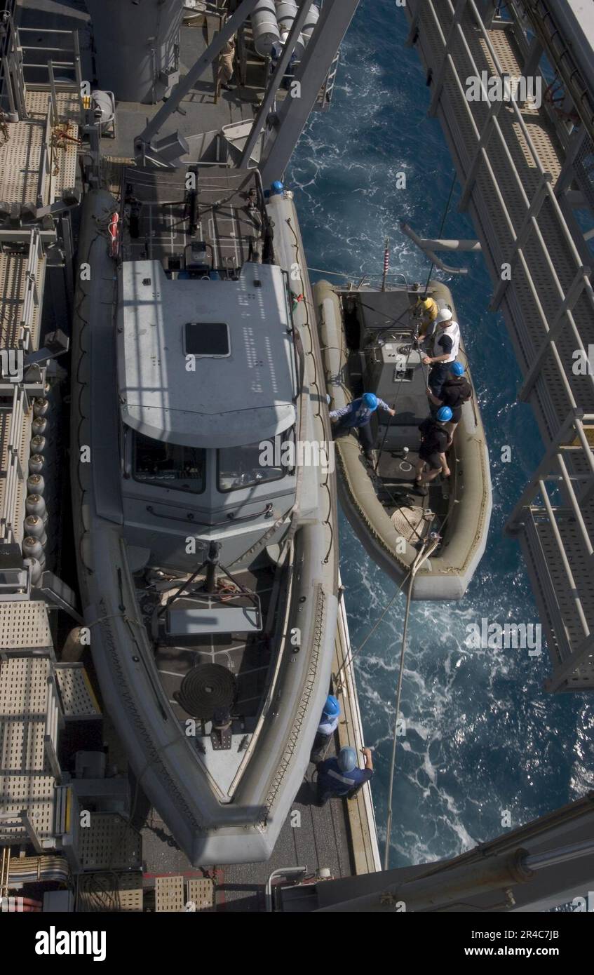 US Navy A Rigid Hull Inflatable Boat is lowered from a boat davit