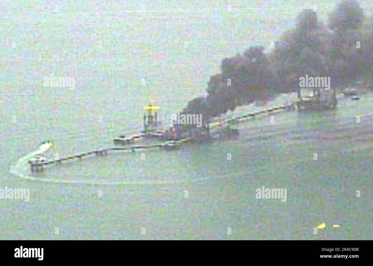 US Navy  A fire aboard the Iraqi Khawr Al Amaya oil terminal (KAAOT) burns in the North Persian Gulf May 26, 2006. Stock Photo