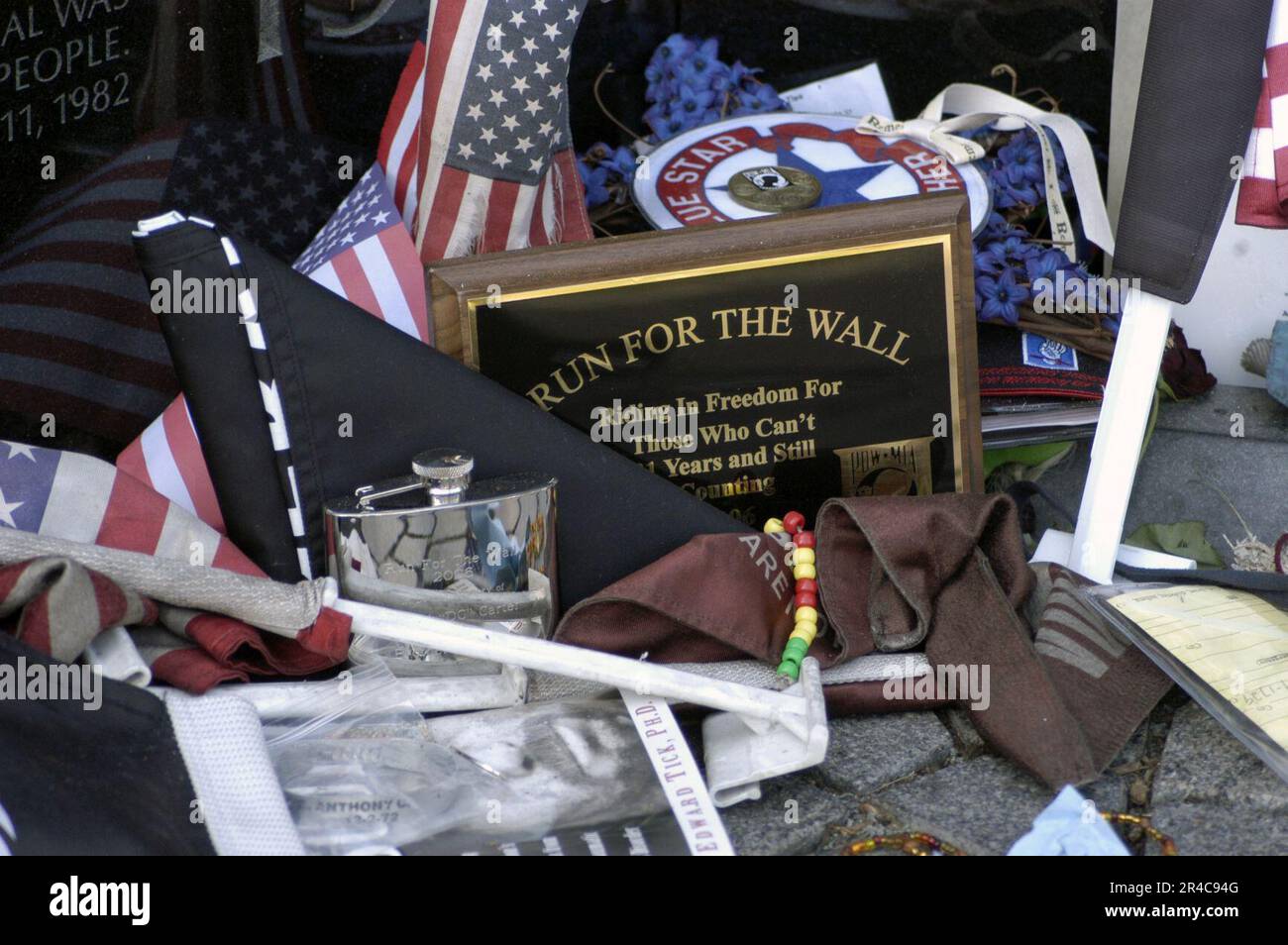 US Navy  A small display of American flags and keep sake articles are left along the Vietnam Veterans Memorial during the Memorial Day holiday weekend by 2006 ''Rolling Thunder – The Run for the Wall''. Stock Photo