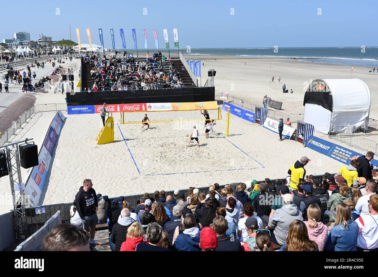 27 May 2023, Lower Saxony, Norderney: The team of ' Hauptstadt Beacher e.V/ VC Olympia Berlin ' with Eric Stadie and Niklas Rudolf ( black jerseys ) playing against the team Bremen 1860. From 26 to 28 May the 'White Sands Festival' will take place on Norderney. Excursion weather in large parts of Germany: Over the Whitsun weekend into the coming week, partly summery temperatures above 25 degrees are expected. Almost everywhere it will remain mostly dry in the coming days with scattered clouds, as predicted by the German Weather Service. In the Alps, however, there could also be thunderstorms. Stock Photo