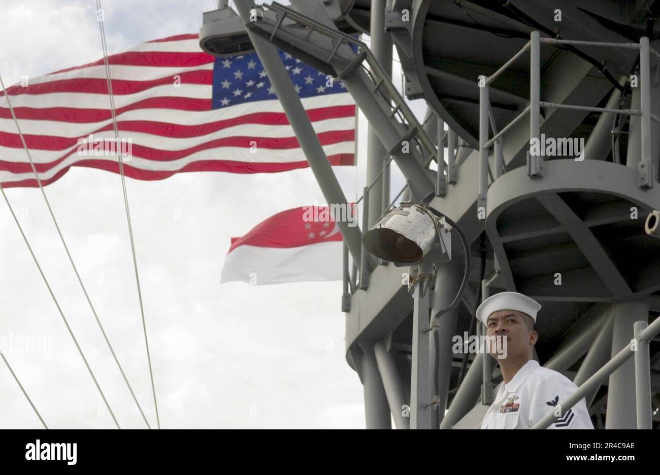 US Navy Personnel Specialist 1st Class mans the rails aboard the amphibious dock landing ship