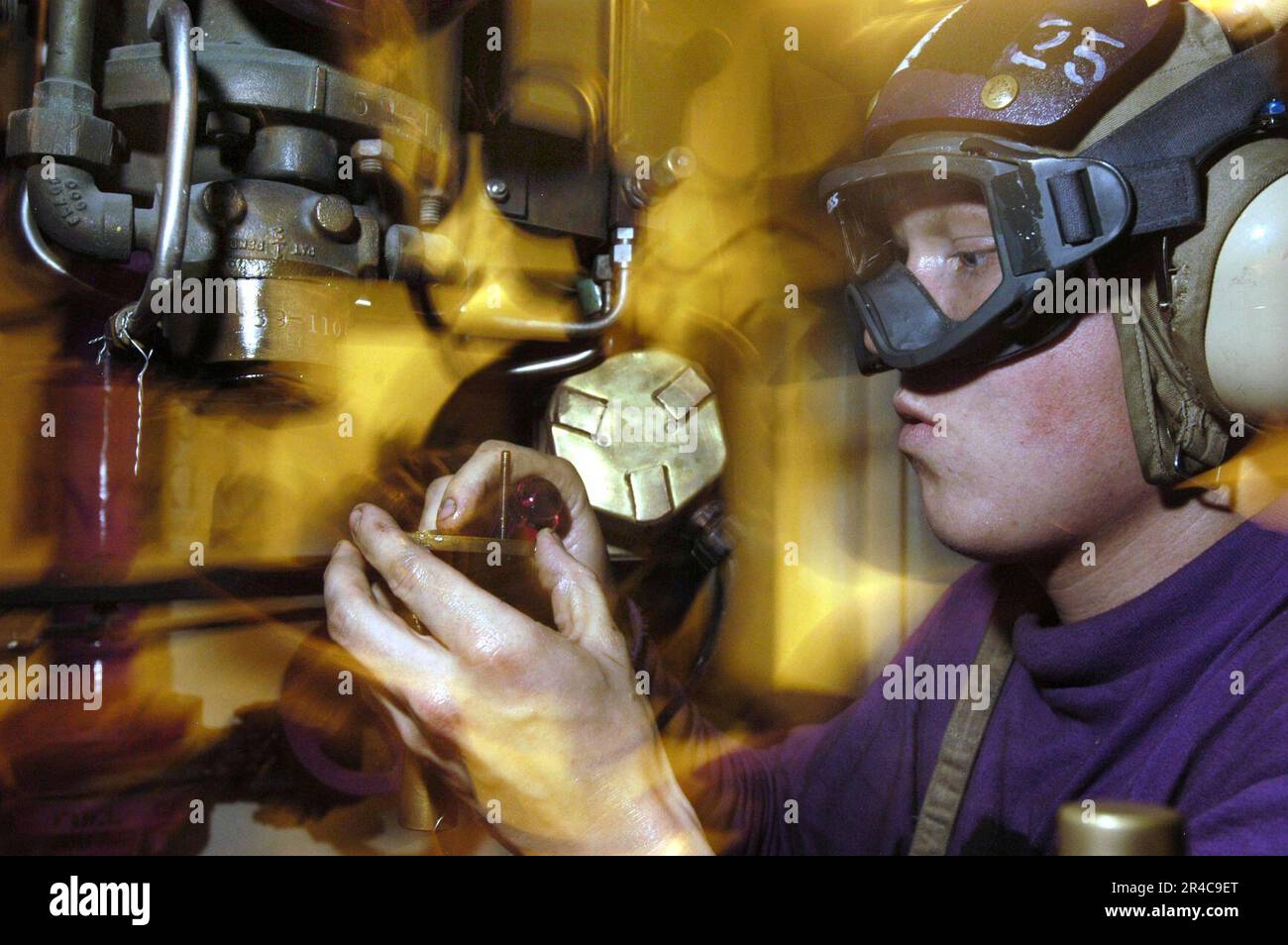 US Navy Aviation Boatswain's Mate (Fuels) Airman changes the diaphragm