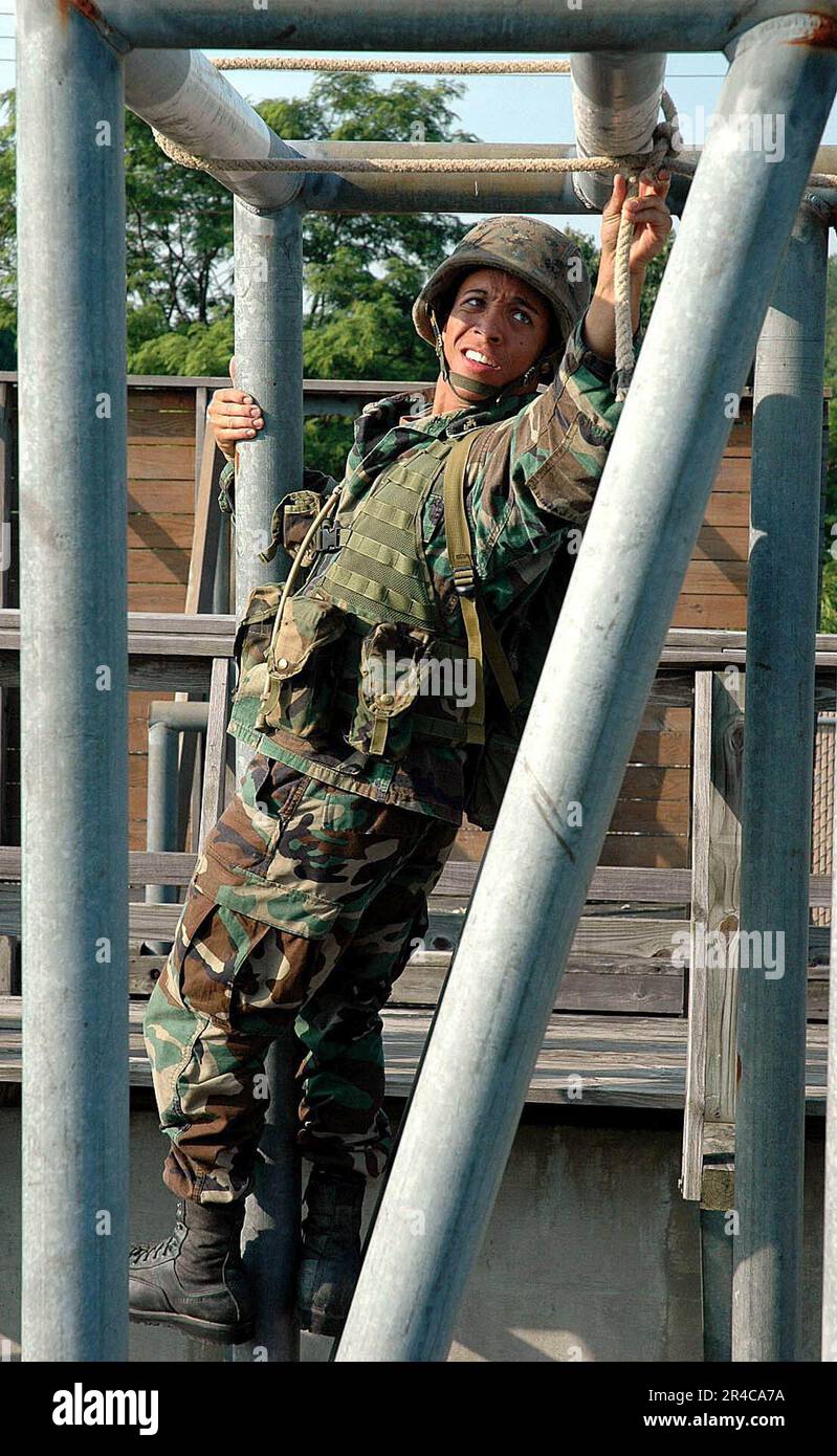 US Navy A U.S. Naval Academy Midshipmen navigates the obstacle course at U.S. Marine Corps Base