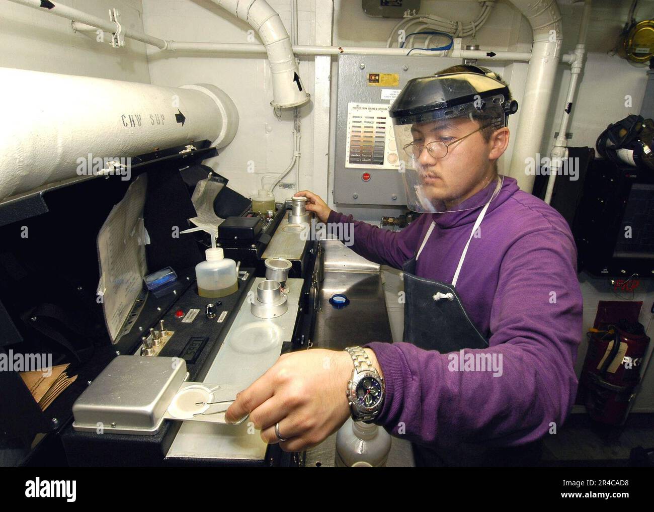 US Navy Aviation Boatswain's Mate Fuels 3rd Class tests aviation fuel