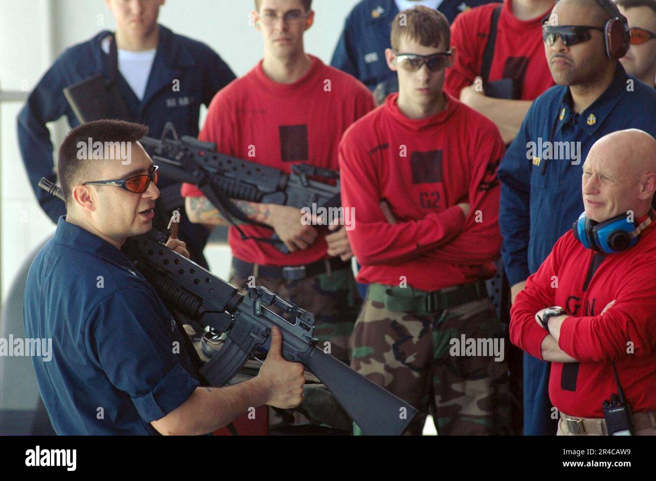 US Navy Gunner's Mate 1st Class discusses proper procedures for loading