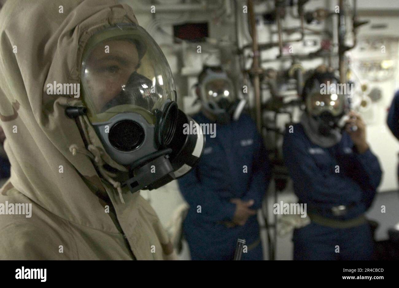 US Navy Seaman wears an Advanced Chemical Protective Garment (ACPG ...