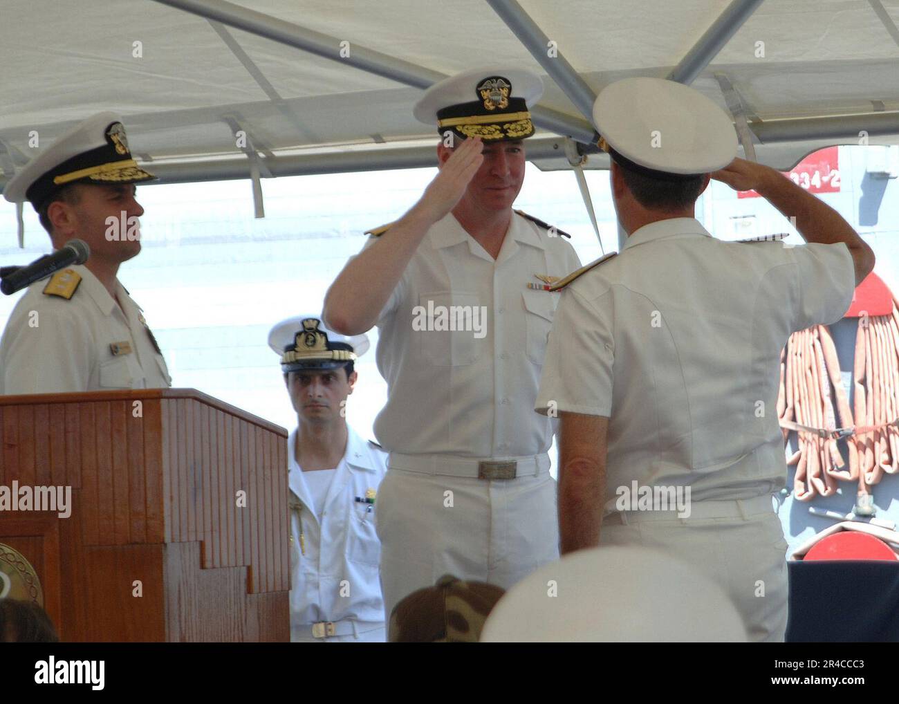 US Navy  - Deputy Commander, U.S. Naval Forces Central Command-5th Fleet, Rear Adm. John Miller, salutes Italian Rear Adm. assumed command of Combined Task Force (CTF-152). Stock Photo