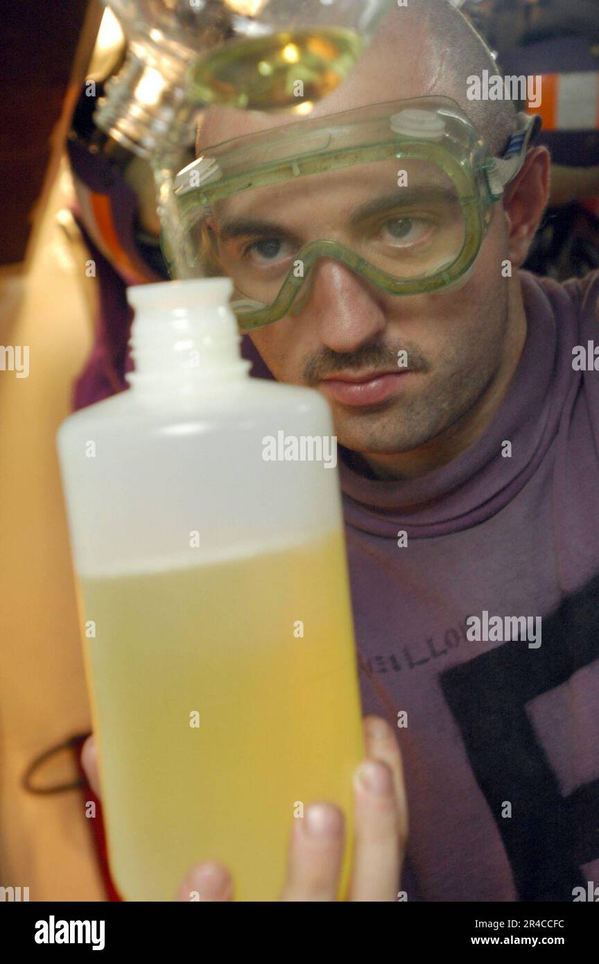 US Navy Aviation Boatswain's Mate Fuels Airman Prepares A Fuel Sample ...