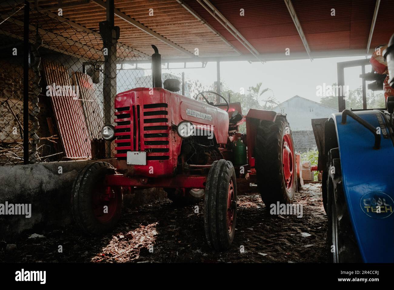 Tractor parked in barn hi-res stock photography and images - Alamy