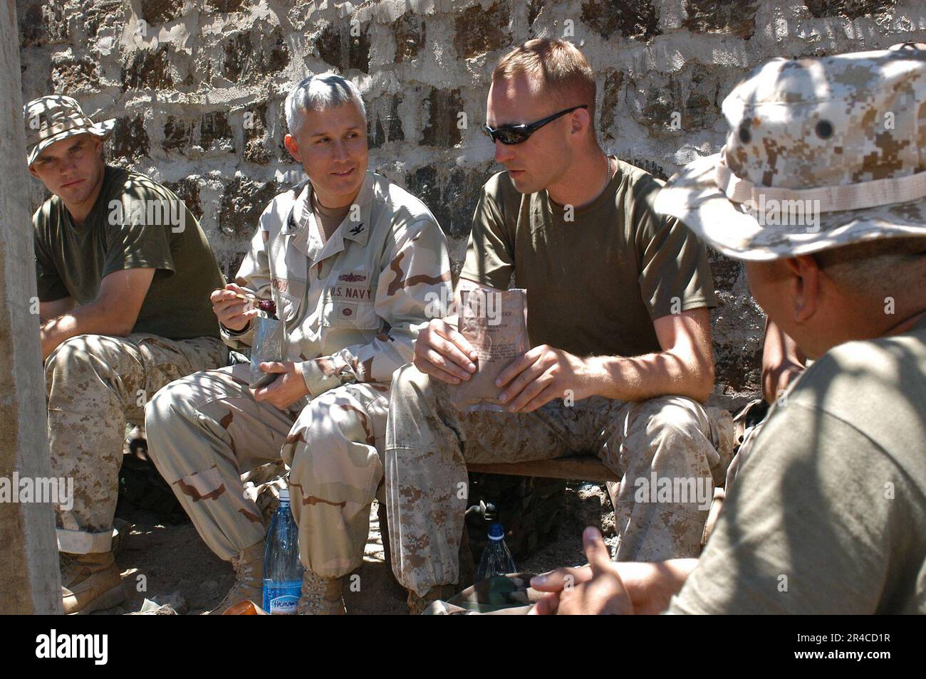 US Navy U.S. Navy Capt. left center, chats with U.S. Marine Sgt. about ...
