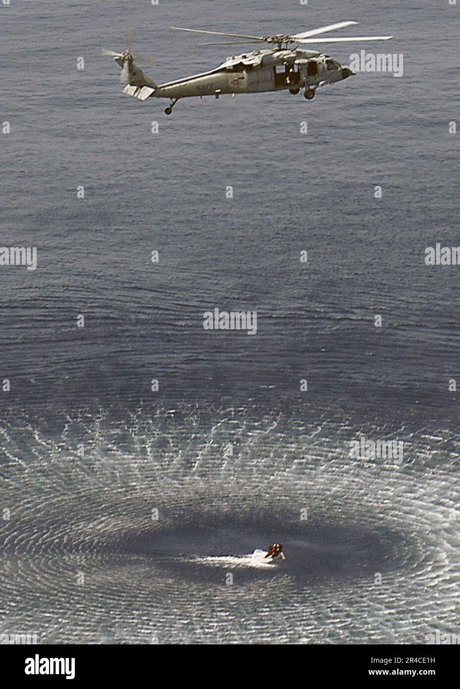 US Navy A search and rescue swimmer (SAR) is hoisted out of the water by an MH60S Seahawk