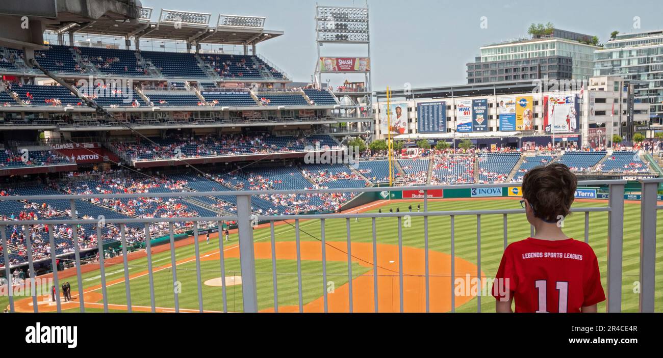 Washington, DC - A child waits for the beginning of a baseball game between the Detroit Tigers and the Washington Nationals at Nationals Park. Stock Photo